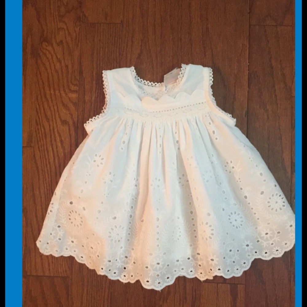 Beautiful white eyelet sundress fully lined. Large whited unattached sash
